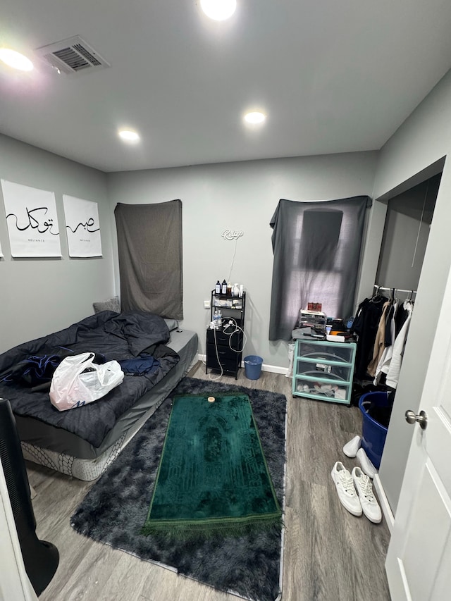 bedroom with wood-type flooring