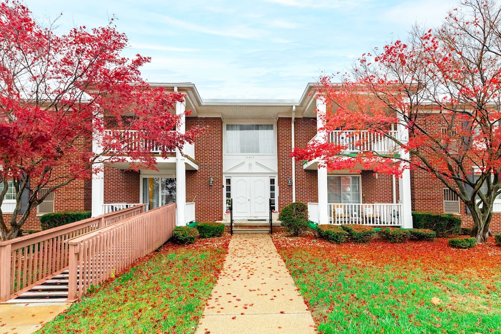 view of front of home with a balcony