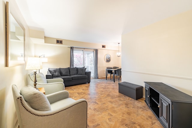 living room with a notable chandelier