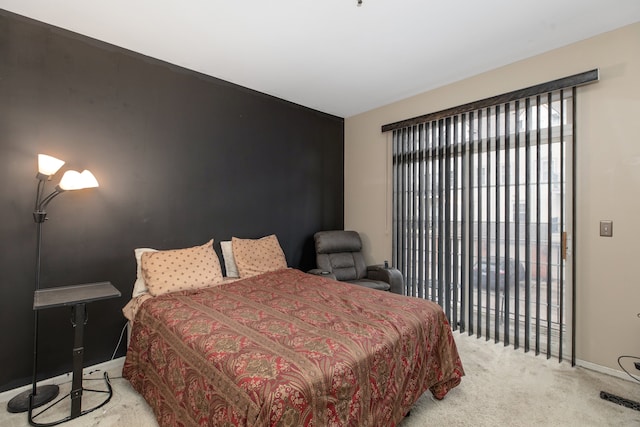 bedroom with light colored carpet