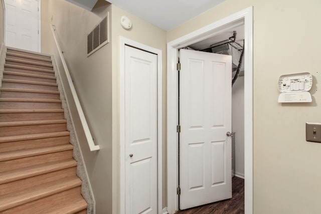 stairway featuring hardwood / wood-style flooring