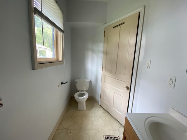 bathroom with vanity and toilet