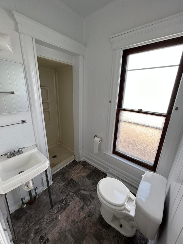 bathroom with toilet and walk in shower