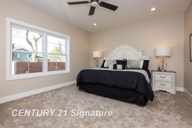 bedroom featuring light carpet and ceiling fan