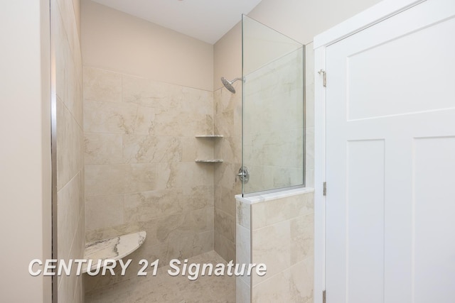 bathroom featuring tiled shower