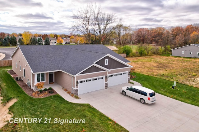 view of front facade with a garage and a front yard