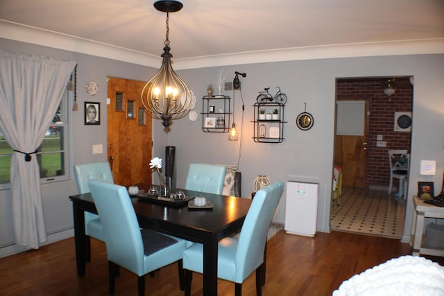 5831 Stadium Dr, Kalamazoo, MI 49009 - dining room with an inviting chandelier and wood finished floors