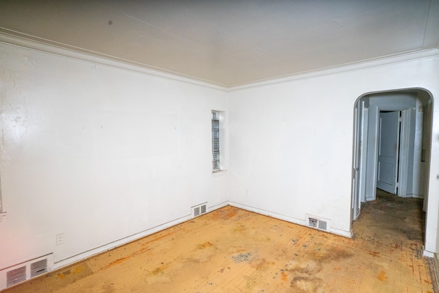 spare room featuring ornamental molding