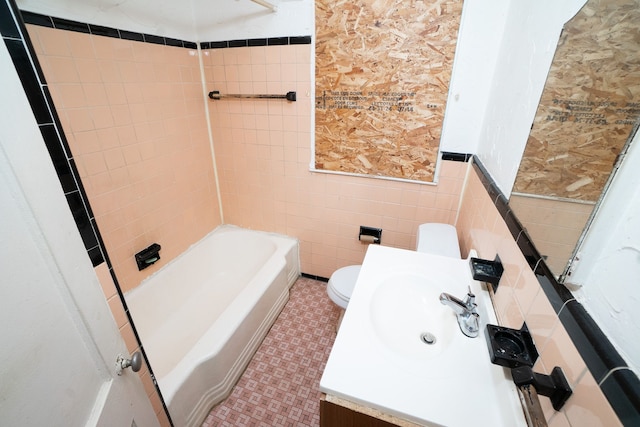 4224 W Davison, Detroit, MI 48238 - bathroom featuring toilet, wainscoting, vanity,  shower combination, and tile walls