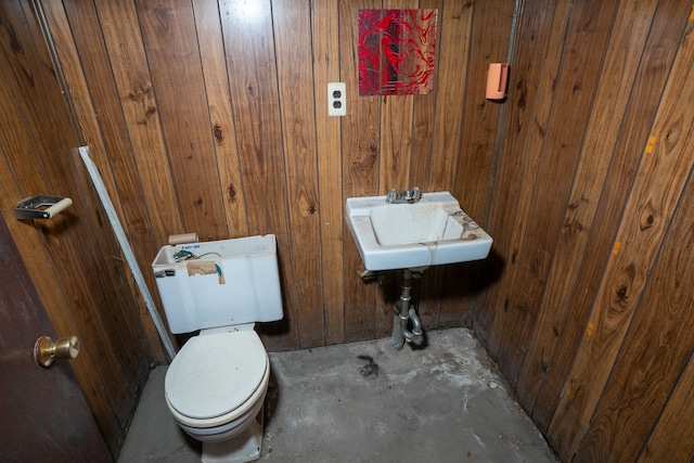 4224 W Davison, Detroit, MI 48238 - bathroom featuring wood walls, concrete flooring, and toilet