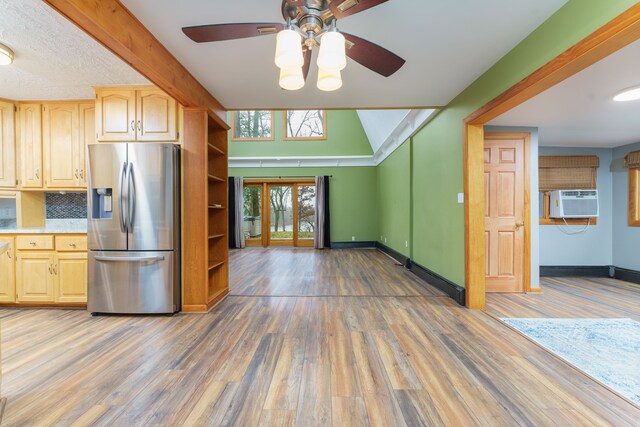 kitchen with stainless steel fridge with ice dispenser, light brown cabinets, ceiling fan, and wood-type flooring