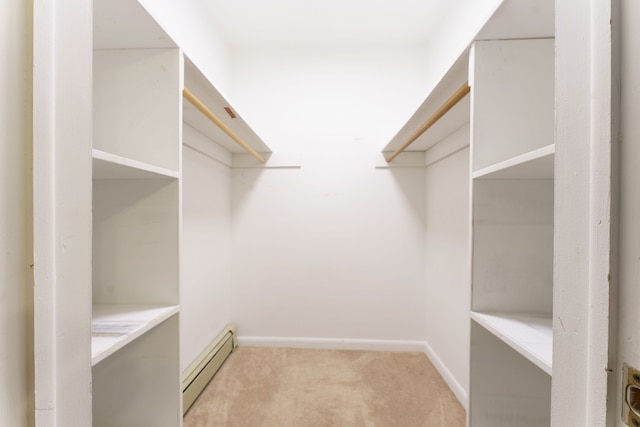 771 Hurley Dr, Howell, MI 48843 - walk in closet featuring baseboard heating and light carpet