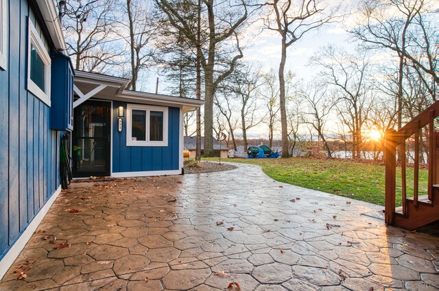 patio terrace at dusk with a yard