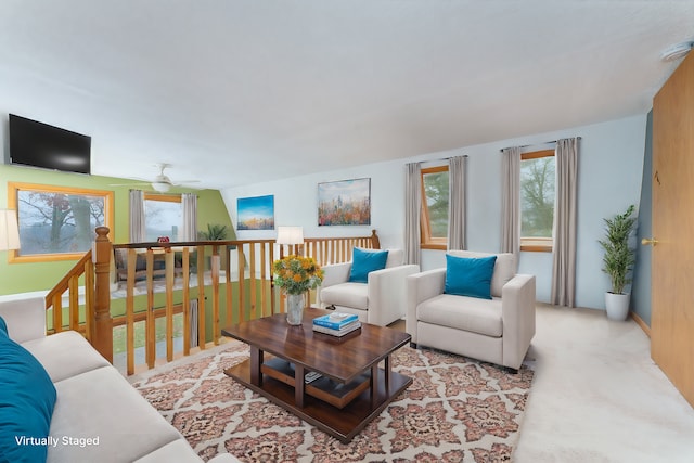 living room with ceiling fan and light colored carpet