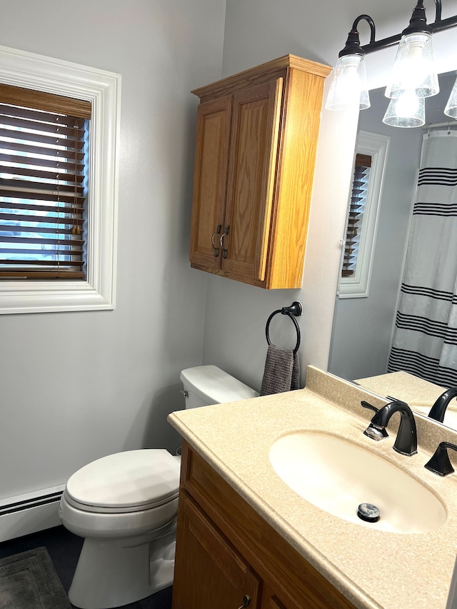 771 Hurley Dr, Howell, MI 48843 - bathroom with toilet, baseboard heating, and vanity