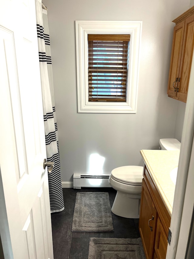 771 Hurley Dr, Howell, MI 48843 - bathroom featuring a baseboard radiator, toilet, vanity, and baseboards