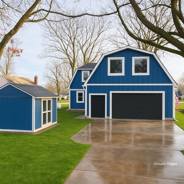 771 Hurley Dr, Howell, MI 48843 - garage featuring a garage, a storage unit, and concrete driveway