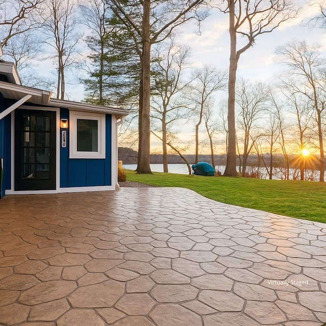 771 Hurley Dr, Howell, MI 48843 - patio terrace at dusk featuring a water view and a yard