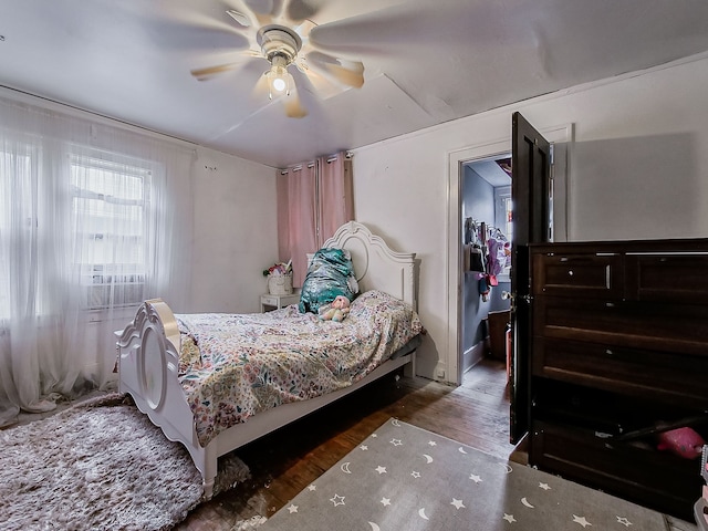 bedroom featuring ceiling fan and dark hardwood / wood-style flooring