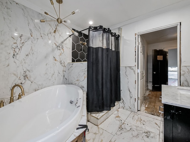 bathroom with a bathing tub, crown molding, vanity, and tile walls