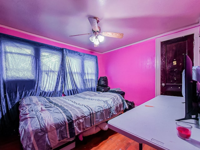 bedroom with hardwood / wood-style floors and ceiling fan