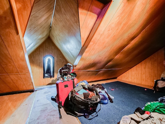 additional living space featuring carpet flooring, wooden walls, wood ceiling, and lofted ceiling