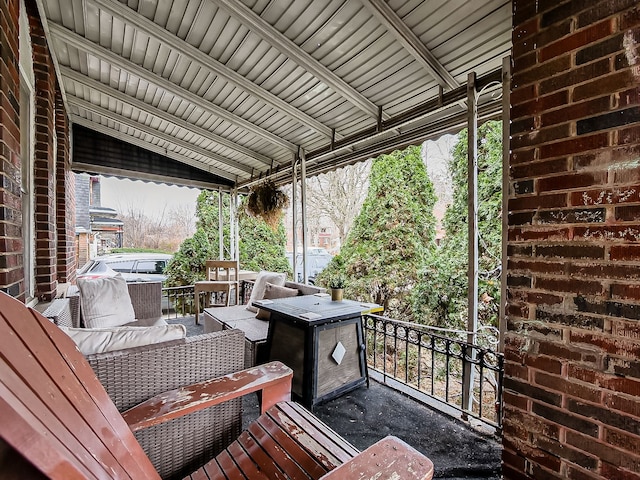 view of patio with an outdoor hangout area and a balcony