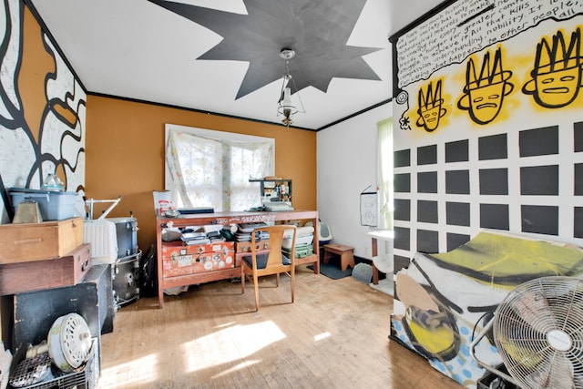 office with hardwood / wood-style floors and crown molding