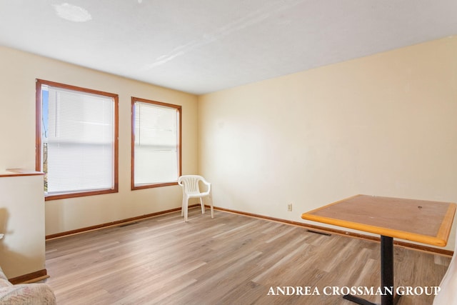 empty room with light hardwood / wood-style flooring