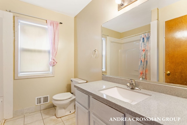 bathroom with a shower with curtain, tile patterned flooring, vanity, and toilet