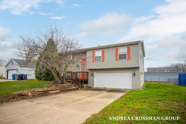 bi-level home featuring a front lawn and a garage