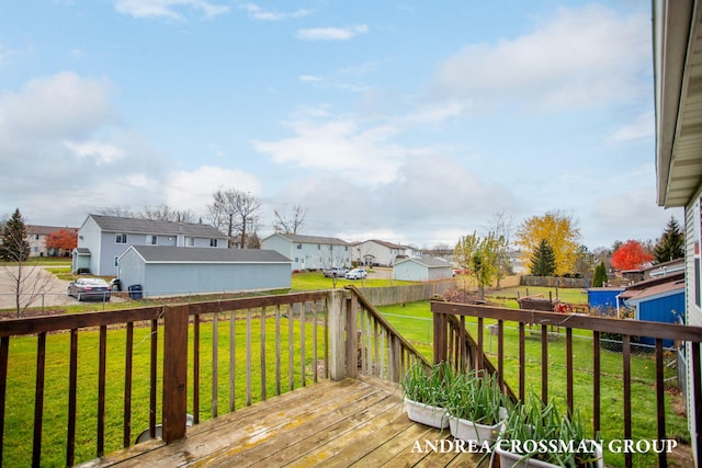 wooden deck with a lawn