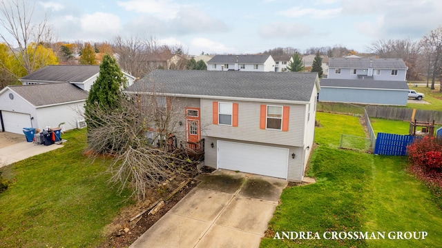 view of front facade featuring a front yard and a garage