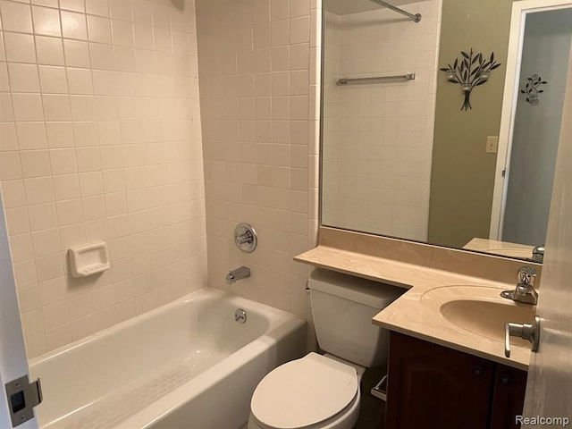 full bathroom featuring tub / shower combination, vanity, and toilet