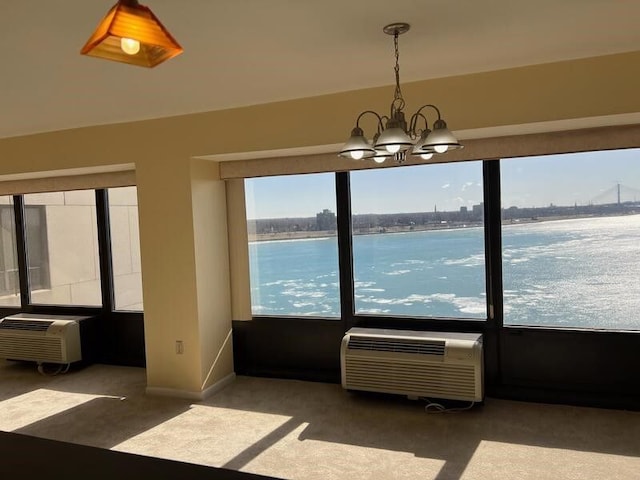 1001 W Jefferson Ave Unit 300/12A, Detroit, MI 48226 - unfurnished dining area featuring a wall mounted AC, a notable chandelier, baseboards, and carpet floors