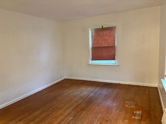 empty room featuring hardwood / wood-style flooring