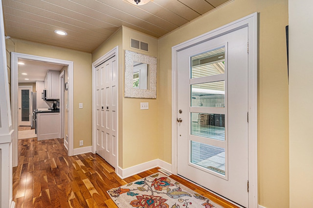 foyer entrance featuring dark wood-type flooring