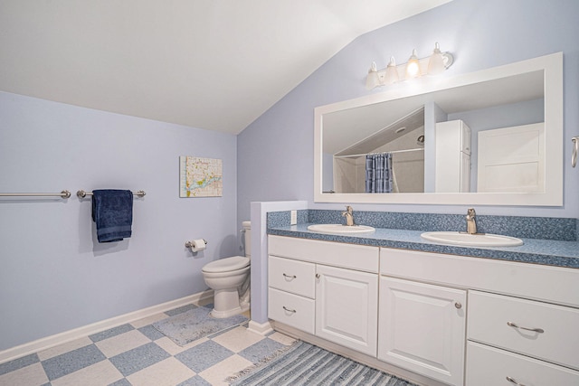 bathroom featuring vanity, curtained shower, toilet, and lofted ceiling