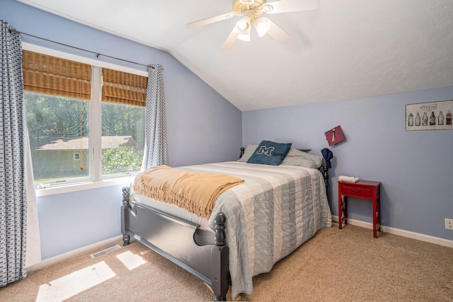 carpeted bedroom featuring ceiling fan and vaulted ceiling