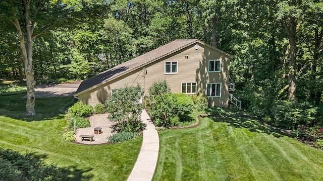 exterior space with a lawn and a patio