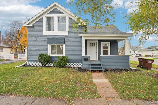 bungalow-style home featuring a front yard