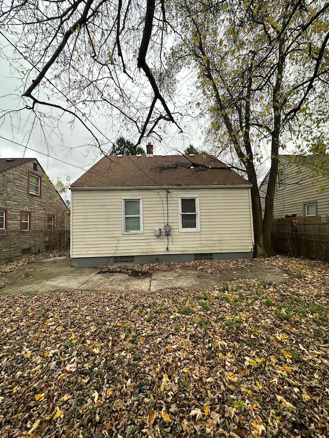 back of property with a patio