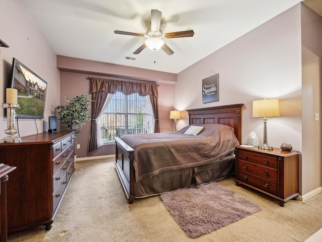 bedroom with light carpet and ceiling fan