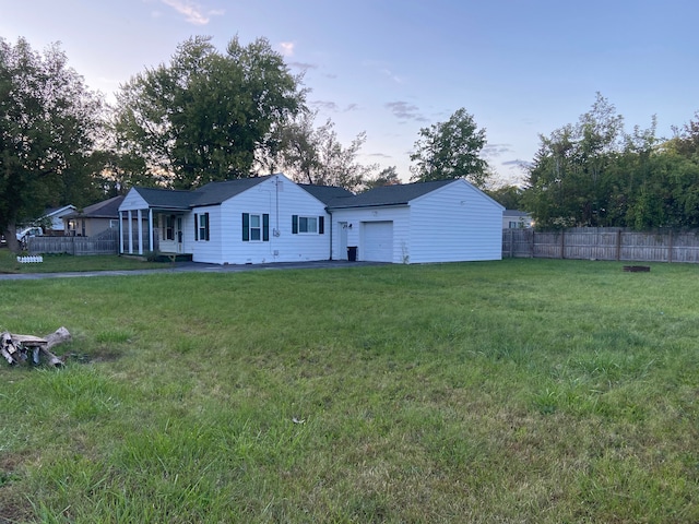 exterior space featuring a front lawn and a garage