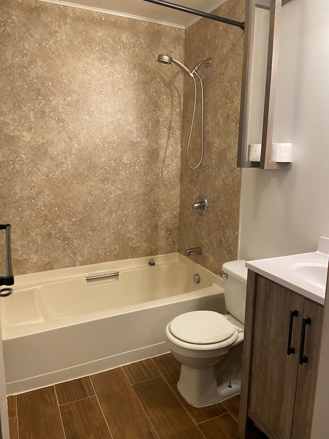 full bathroom with vanity, tiled shower / bath combo, and toilet