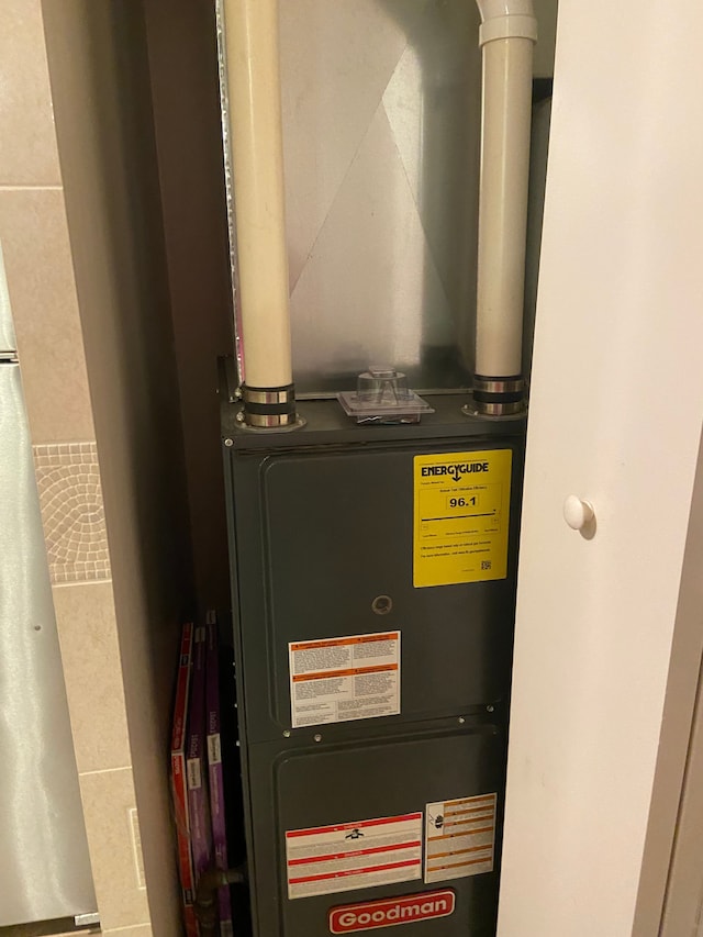 utility room with heating unit