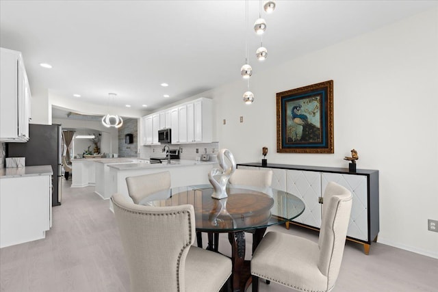 dining area with light hardwood / wood-style flooring