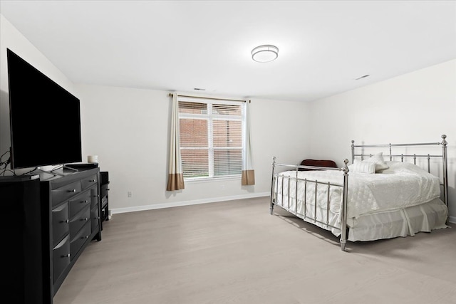 bedroom featuring light hardwood / wood-style floors