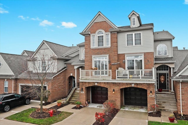 multi unit property featuring a balcony and a garage