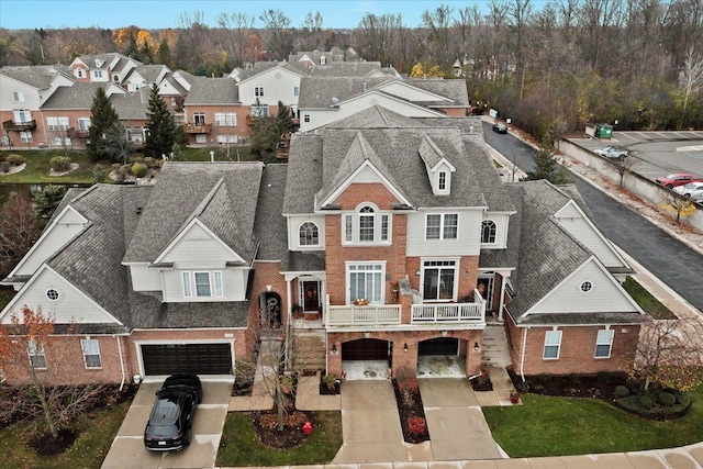 view of front of house featuring a balcony and a garage